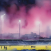Painterly watercolour of an English football stadium at night under a magenta sky with floodlight glow