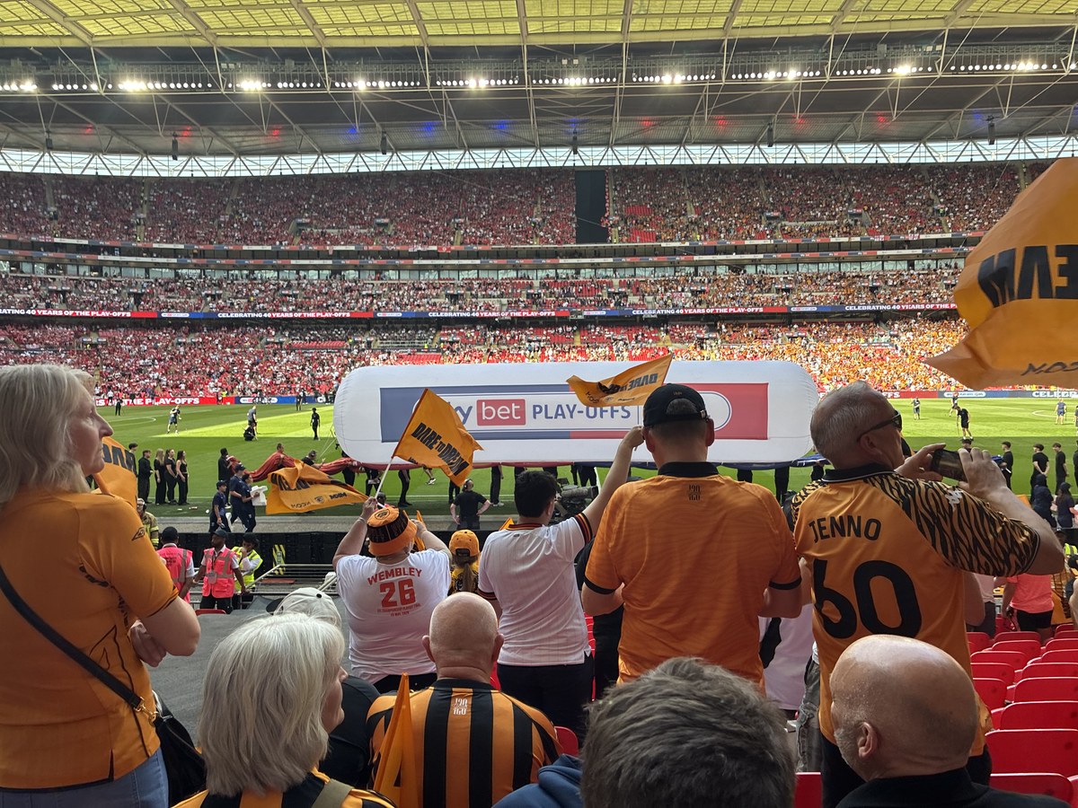 Hull City supporters waving flags inside Wembley